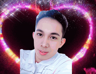 A Man 'S Face Is Surrounded By A Heart Shaped Background GIF