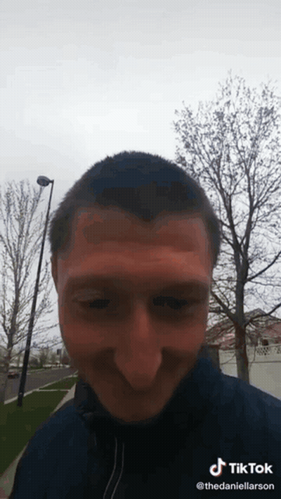 A Man 'S Face Is Visible In A Tik Tok Video GIF