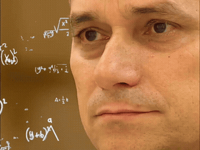 A Man 'S Face Is Visible In Front Of A Chalkboard With Math Equations GIF