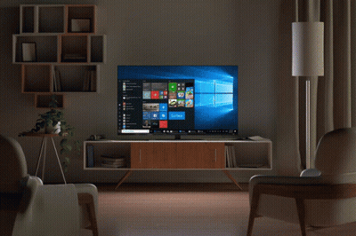 A Man 'S Hand Is Pointing At A Computer Screen That Says Surface GIF