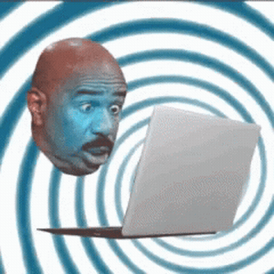 A Man 'S Head Is Floating Above A Laptop Computer GIF