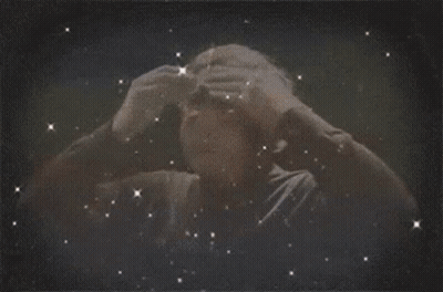 A Man 'S Head Is Surrounded By Lightning Bolts GIF