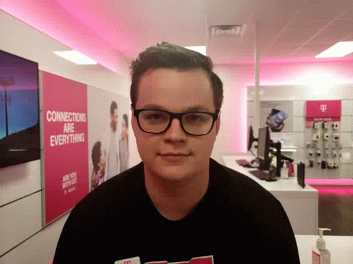 A Man 'S Head Is Upside Down In Front Of A Pink Wall That Says Everything Are Connections GIF