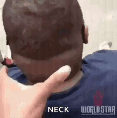 A Man 'S Neck Is Being Touched By A Person 'S Hand . GIF