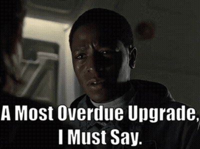 A Man Says " A Most Overdue Upgrade I Must Say " In A Dark Room GIF