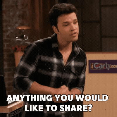 A Man Says Anything You Would Like To Share In Front Of A Sign That Says Icarly.com GIF