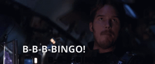 Man Saying B-B-B-Bingo In Front Of Dark Background GIF