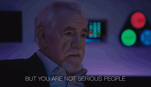 A Man Says But You Are Not Serious People In A Dark Room GIF