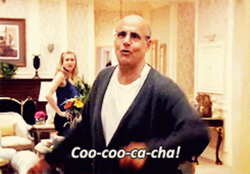 A Man Says Coo-Coo-Ca-Cha In Front Of A Woman GIF