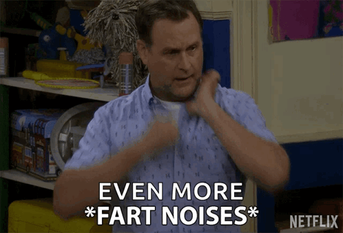 A Man Says " Even More Fart Noises " In Front Of A Shelf Of Toys GIF