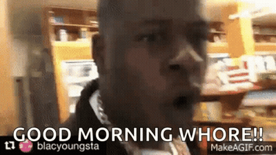 A Man Says Good Morning Whore In Front Of A Kitchen GIF
