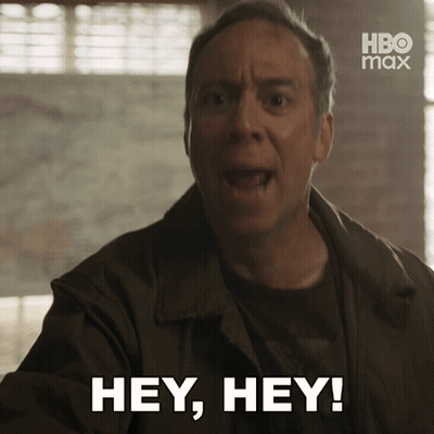 A Man Says " Hey Hey " In Front Of A Hbo Max Logo GIF