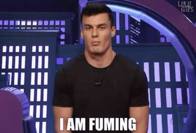 A Man Says I Am Fuming In Front Of A City Background GIF