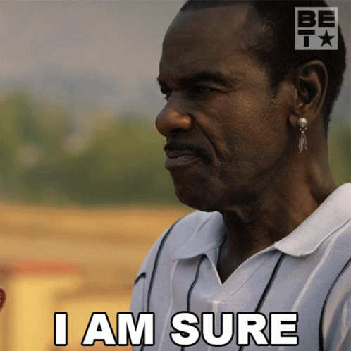 A Man Says I Am Sure In Front Of A Be T Logo GIF