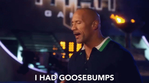 A Man Says I Had Goosebumps In Front Of A Sign GIF