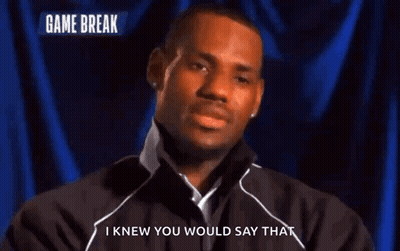 A Man Says I Knew You Would Say That In Front Of A Blue Curtain GIF