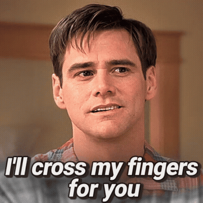 A Man Says " I 'Ll Cross My Fingers For You " While Looking At The Camera GIF