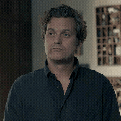 A Man Says I 'Ll Take It In Front Of A Wine Shelf GIF