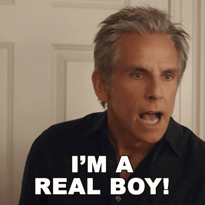 A Man Says I 'M A Real Boy In Front Of A Door GIF