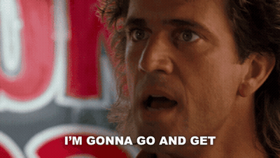 A Man Says " I 'M Gonna Go And Get " In Front Of A Neon Sign GIF
