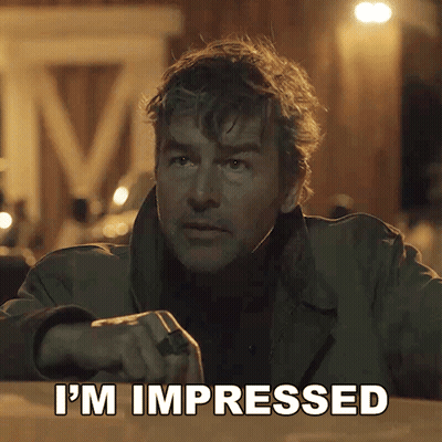 A Man Says I 'M Impressed In Front Of A Sign That Says M GIF