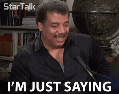A Man Says I 'M Just Saying While Speaking Into A Microphone GIF