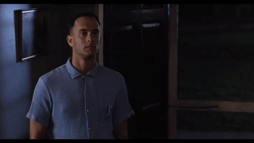 A Man Says I 'M Not A Smart Man While Standing In A Dark Room GIF