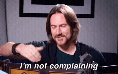 A Man Says I 'M Not Complaining In Front Of A Shield GIF