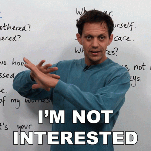 A Man Says I 'M Not Interested While Standing In Front Of A White Board GIF