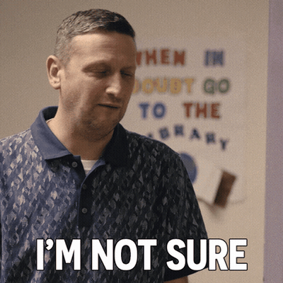 A Man Says I 'M Not Sure In Front Of A Sign That Says When I 'M Doubt Go To The Library GIF