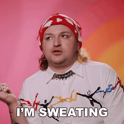 A Man Says I 'M Sweating While Wearing A Red Hat GIF