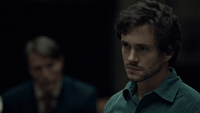 A Man Says " I Thought About It " In A Dark Room GIF