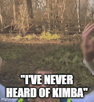 A Man Says " I 'Ve Never Heard Of Kimba " In Front Of A Fence GIF