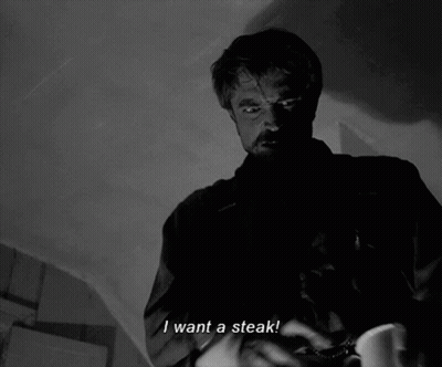 A Man Says I Want A Steak In A Black And White Scene GIF