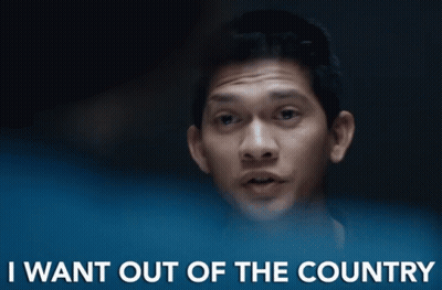 A Man Says " I Want Out Of The Country " In Front Of A Dark Background GIF