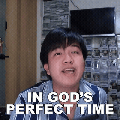 A Man Says In God 'S Perfect Time While Wearing A Striped Shirt GIF