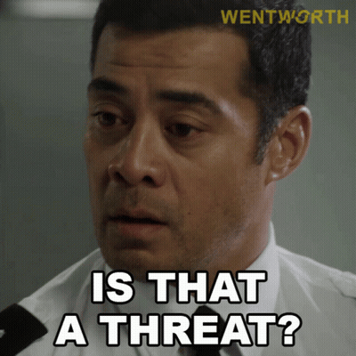 A Man Says " Is That A Threat " While Wearing A White Shirt And Black Tie GIF