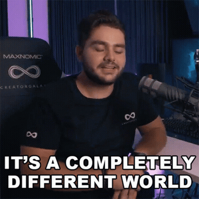 A Man Says It 'S A Completely Different World In Front Of A Microphone GIF