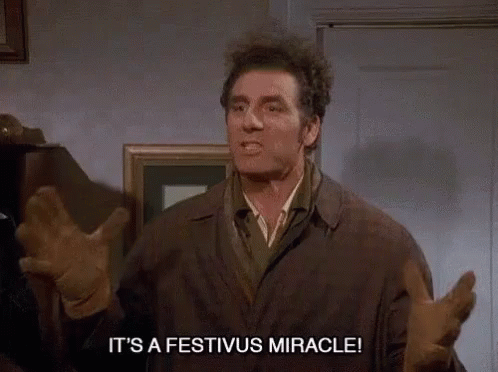 A Man Says It 'S A Festivus Miracle While Standing In A Room GIF