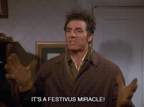 A Man Says It 'S A Festivus Miracle While Standing In A Room GIF