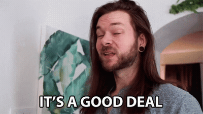 A Man Says It 'S A Good Deal In Front Of A Painting GIF