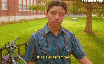 A Man Says It 'S A Sledgehammer In Front Of A Bike GIF