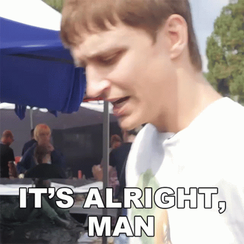 A Man Says It 'S Alright Man While Standing In Front Of A Blue Tent GIF