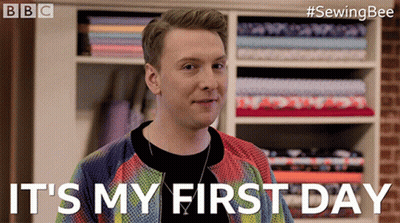 A Man Says It 'S My First Day In Front Of A Shelf Of Fabric GIF