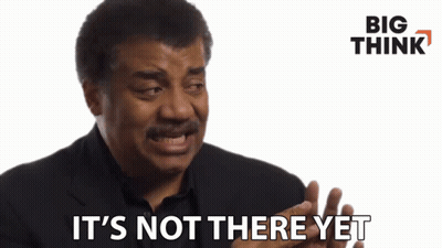 A Man Says " It 'S Not There Yet " In Front Of A White Background GIF
