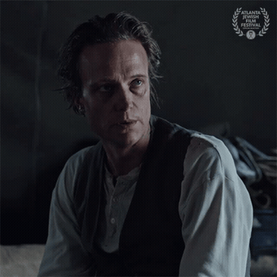 A Man Says Just Tell Me While Sitting In A Dark Room GIF