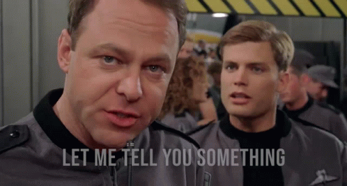 A Man Says Let Me Tell You Something While Standing Next To Another Man In A Military Uniform GIF