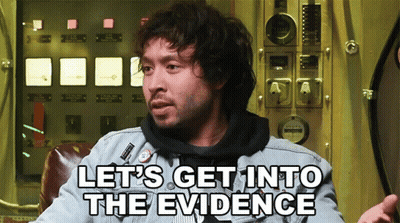 A Man Says Let 'S Get Into The Evidence While Sitting In Front Of A Panel GIF
