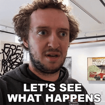 A Man Says Let 'S See What Happens In Front Of A Wall Of Paintings GIF
