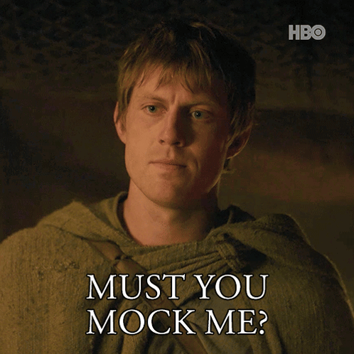 A Man Says " Must You Mock Me " While Wearing A Green Cloak GIF